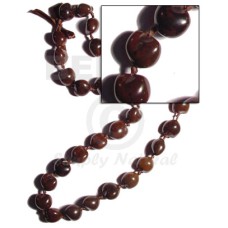 Brown kukui nuts ribbon lei Brown kukui nuts ribbon lei